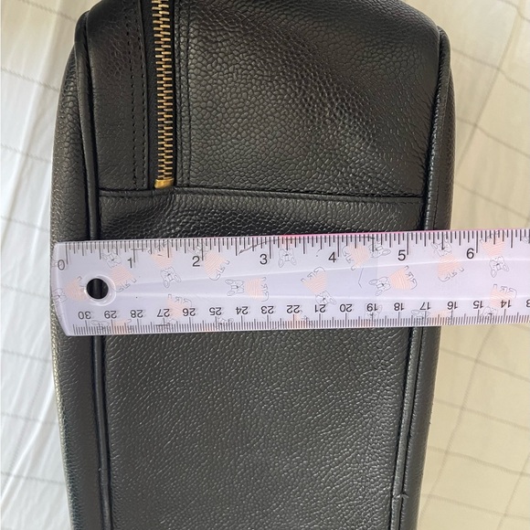 Chanel black leather bag with gold chain handle.There is a small cut on lock tag - Picture 8 of 14